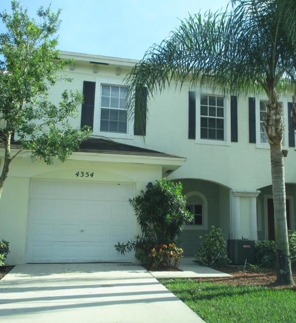 3/2/1 Townhouse w/ Garage, Built 2007,Open Floor Plan, Breakfast Bar, 2 Sliding Glass Doors Open to Private Patio w/ Lake Views, Foyer has Trey Ceilings, Master Suite Complete w/ Double Doors, Roman Tub, Separate Glass Shower, Dual Vanity, LG Walk-In Closet, Split Bedrooms, Full W/D, Community Pool, Bike Path, Lake, & Green Space. Close to Major Highways, Tri-Rail, Hospital, Park, PBSC, Shopping. Basic Cable & Internet