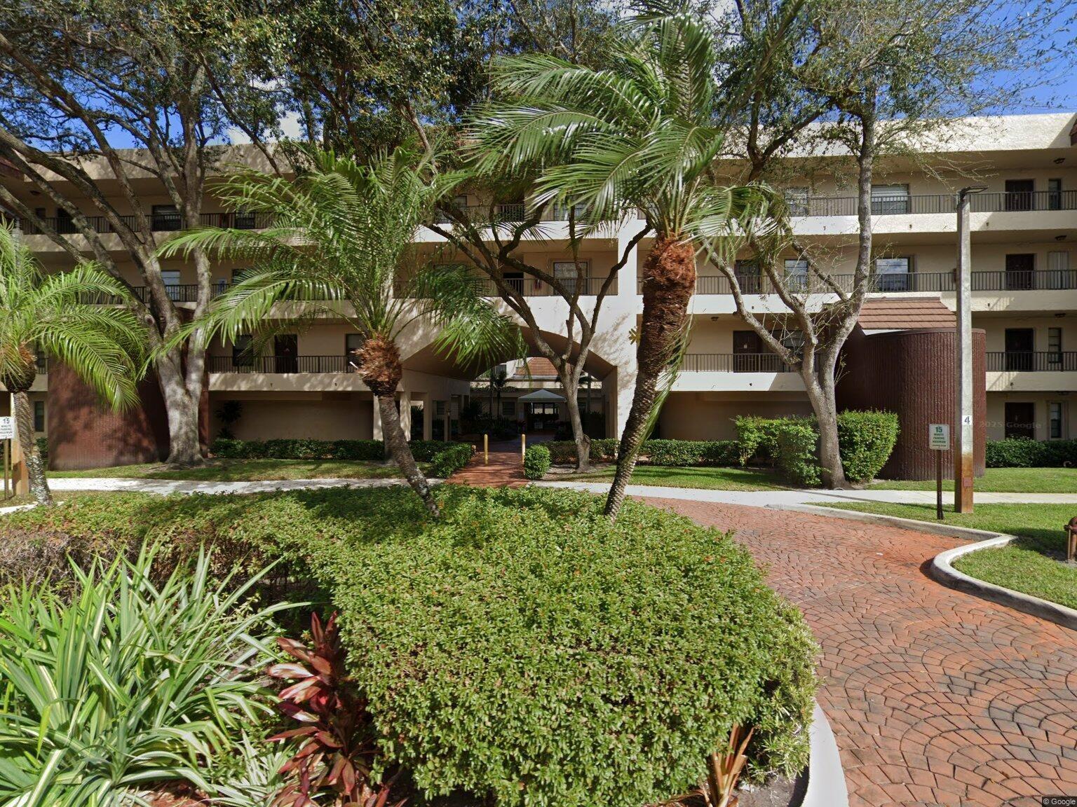 Absolutely beautiful condo in the heart of Plantation! Fourth floor gives you a wonderful view of the community. Elevator for the building. Recently remodeled kitchen is a cook's delight complete with quartz countertops, and beautiful cabinetry. Time to make culinary masterpieces! Pass through into the spacious dining room and living room areas. Large master bedroom with walk in closet. Relaxing master bath with tub/shower combo and a newer vanity. Nice sized second bedroom and a second full bathroom. Private screened balcony with turf and storage room at one end. This unit has a full sized stackable washer and dryer. Beautiful flooring throughout. Water included in maintenance payment. Additional storage locker on your floor.