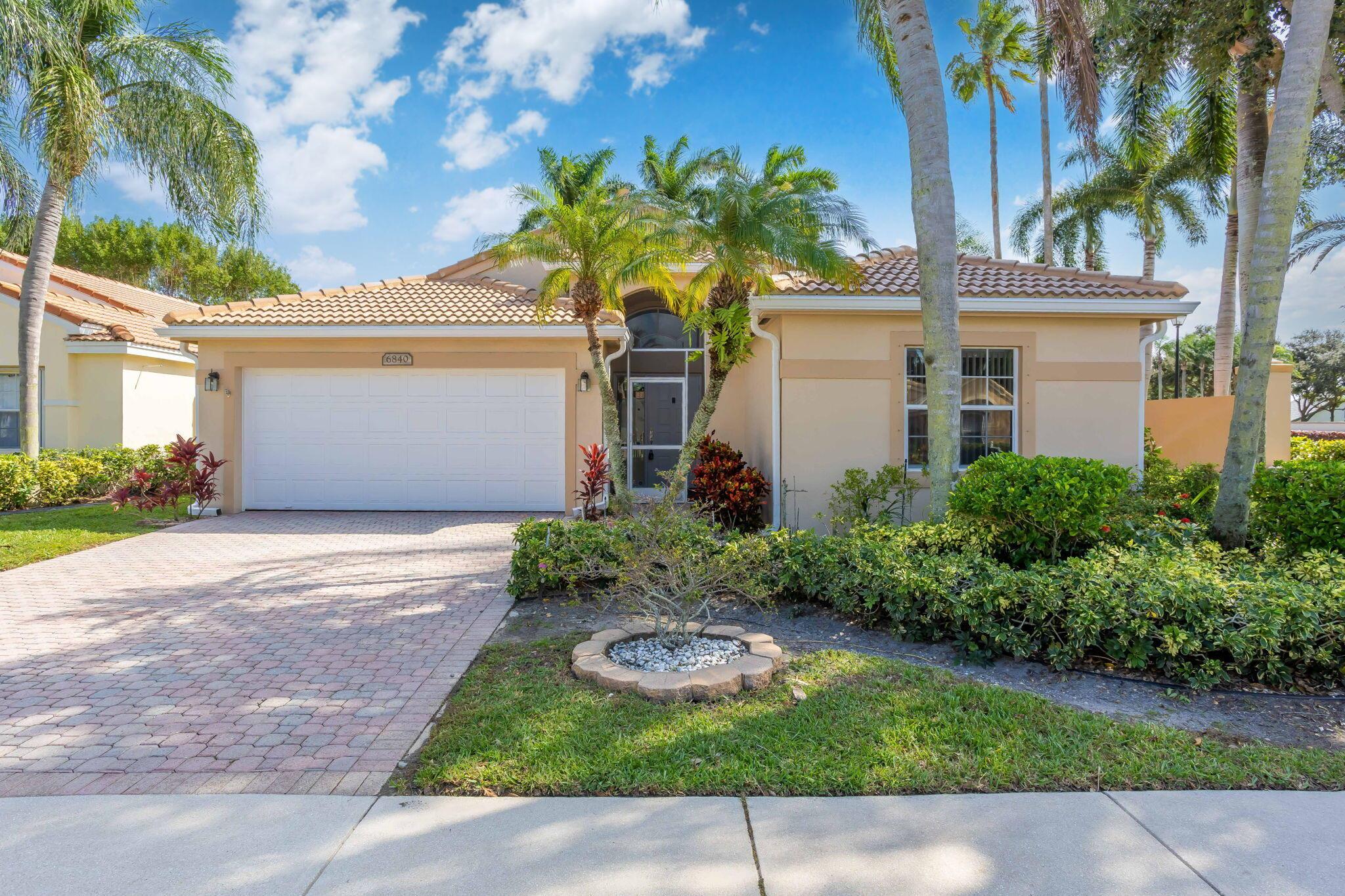 BRAND NEW ROOF, LUXURY VINYL TILE, AND INTERIOR HOUSE PAINTING--all completed in October 2024! Welcome to this inviting corner-lot home in the gated Lakes of Westchester. ALL AGES welcome. Inside, you'll find vaulted ceilings and fresh updates throughout. The private screened patio offers a relaxing retreat, while community amenities include a pool, tennis courts, fitness center, tot lot, and more. Adjacent to the community is the Westchester Country Club, featuring three 9-hole golf courses--with no mandatory membership fees. Located in Boynton Beach, this home offers convenient access to shopping, dining, airports, and beaches.