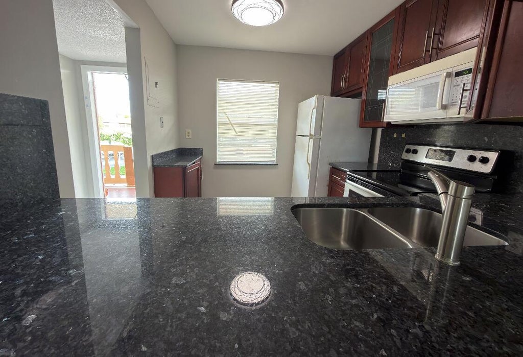 Photo of 9272 SW 3rd Street #414, Boca Raton, FL 33428 (MLS # B26078999)