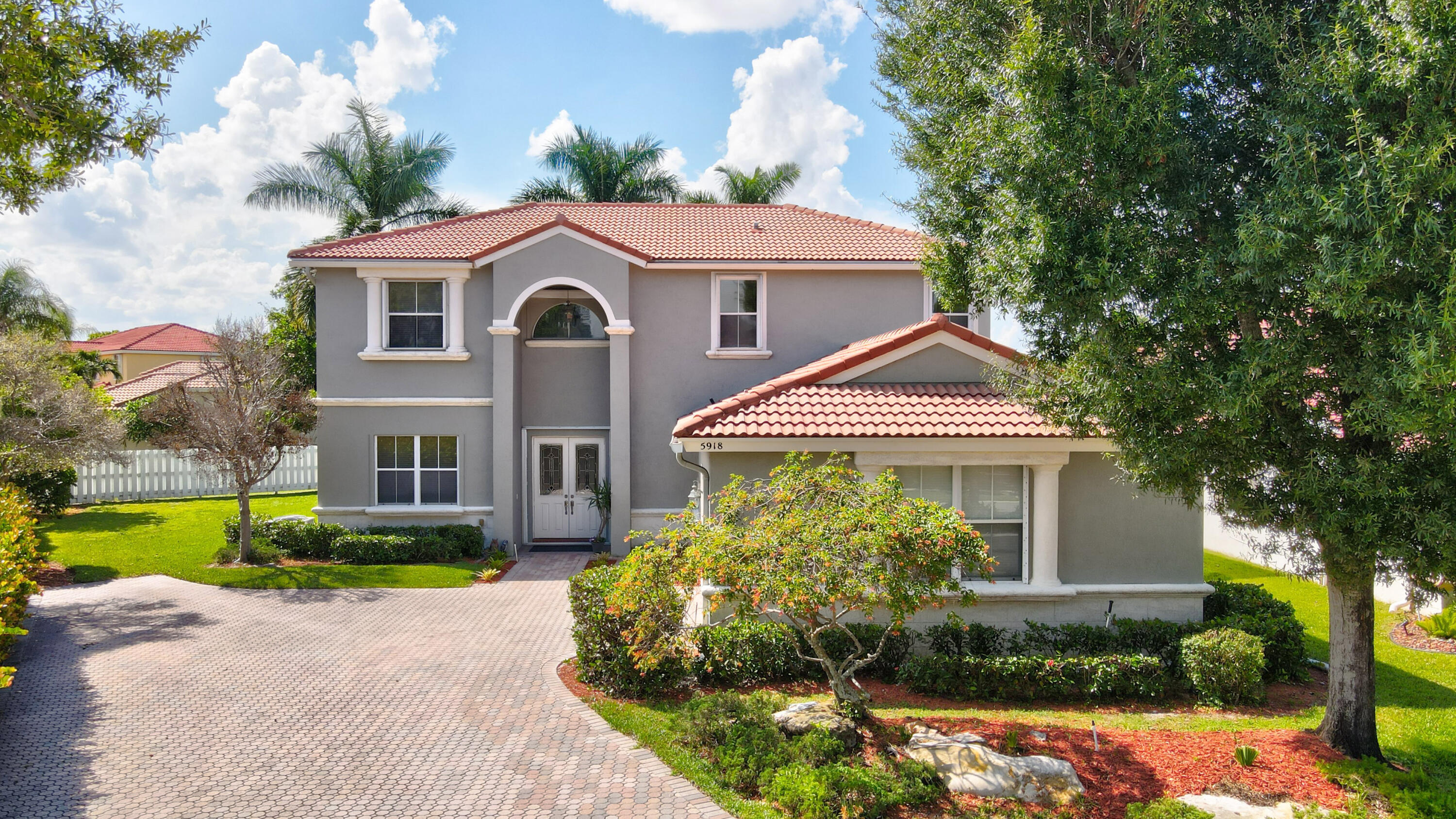 **Upstairs Carpeting was just replaced with beautiful vinyl flooring and new carpet was installed on the staircase!**Sensationally Spacious Two-Story Home in an Excellent A-Rated School District! It is located on a 0.24+acre lot in the highly sought after Bay Hill Village. It is the ONLY gated community within Winston Trails. This 5+BR/3BA property has gorgeous Mediterranean architectural influences, meticulous landscaping, an extended custom paver driveway, traditional Spanish tile roof, with a covered entrance.