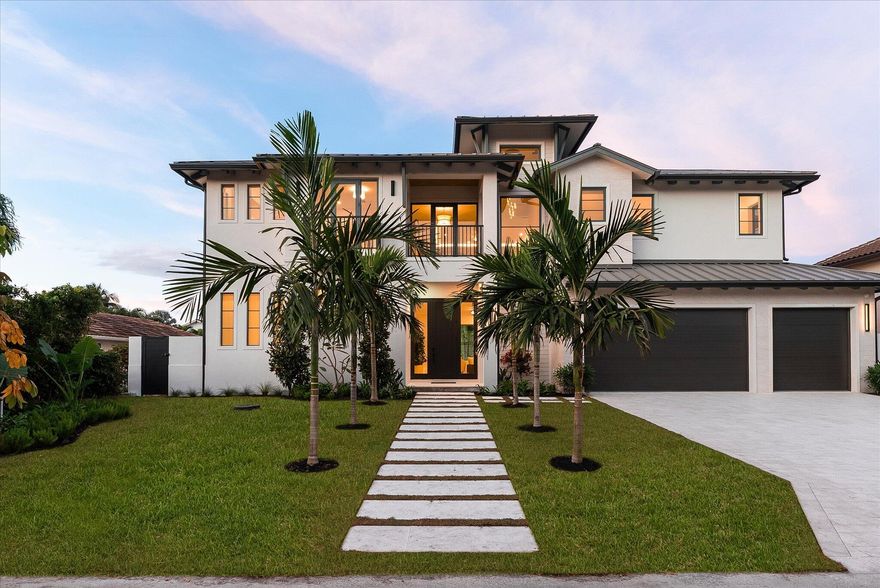 Coastal-modern masterpiece built by Beachfront Builders, set in the highly desirable waterfront boating community of Tropic Isles. This residence blends open, organic, and airy interiors with timeless, classic beauty, delivering a curated living experience in one of Delray Beach's premier neighborhoods. The thoughtfully designed floor plan offers 6 bedrooms and 6.5 bathrooms, including a primary suite on the main level with serene east-facing views over the Intracoastal, allowing you to enjoy the glow of the sunrise from the privacy of your own retreat. The heart of the home is a custom-designed chef's kitchen featuring a Wolf/Sub-Zero appliance package and a hidden butler's area, all blending seamlessly into the expansive living and dining spaces.