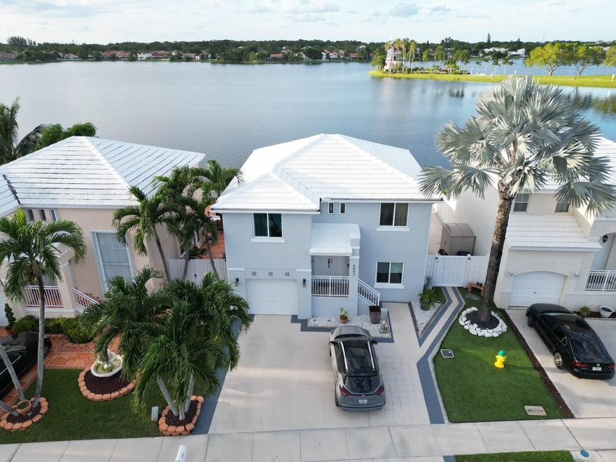 Spectacular Two-story home in a private gated community in the highly sort after Coral Bay community with breathtaking lake-bay views. You can enjoy the beauty of the sunset right from your own backyard with lots of space to relax, chill or entertain with direct view of Bay. Property is in great condition with impact windows and doors, water softener and gutters. Roof was recently painted with silicone which add an additional 10 yrs. to the life of the roof... Spectacular Two-story home in a private gated community in the highly sort after Coral Bay community with breathtaking lake-bay views. You can enjoy the beauty of the sunset right from your own backyard with lots of space to relax, chill or entertain with direct view of Bay. Property is in great condition with impact windows and doors, water softener and gutters. Roof was recently painted with silicone which add an additional 10 yrs. to the life of the roof...