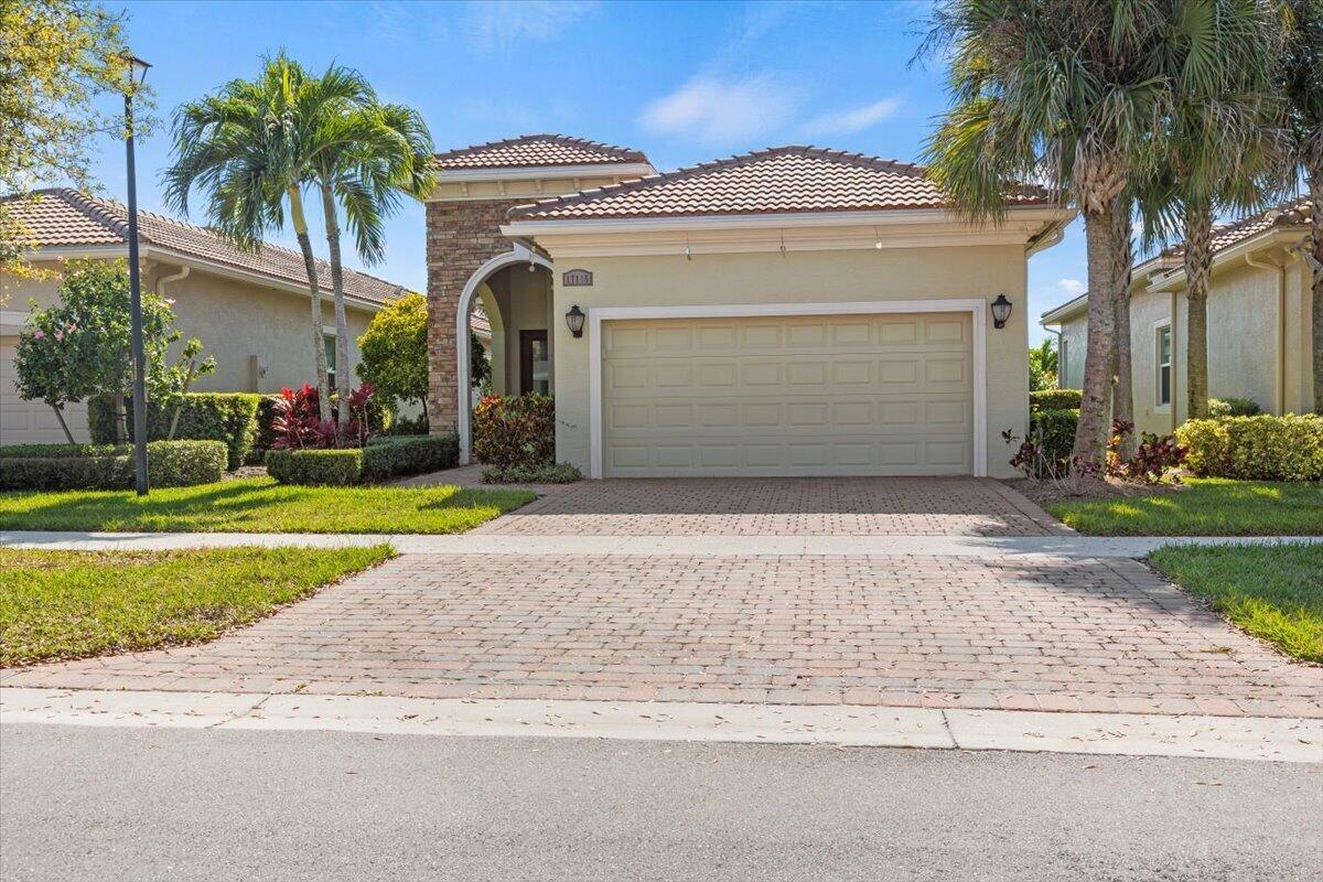 This stunning 2-bed + office (possible 3rd bed), 2-bath, 2-car garage home in PGA Village Verano comes fully furnished with designer touches and upgrades throughout. The open-concept floor plan features vaulted ceilings, wood-look porcelain tile, and a chef's kitchen with quartz countertops, stainless steel appliances, and a large island. Enjoy outdoor living with a spacious paver patio, summer kitchen, and firepit. The primary suite offers a luxurious bath and oversized walk-in closet. With impact glass windows, a fenced yard, and access to top amenities, such a clubhouse, fitness center, and vibrant social environment, this home is perfect for modern living and minutes from I-95.