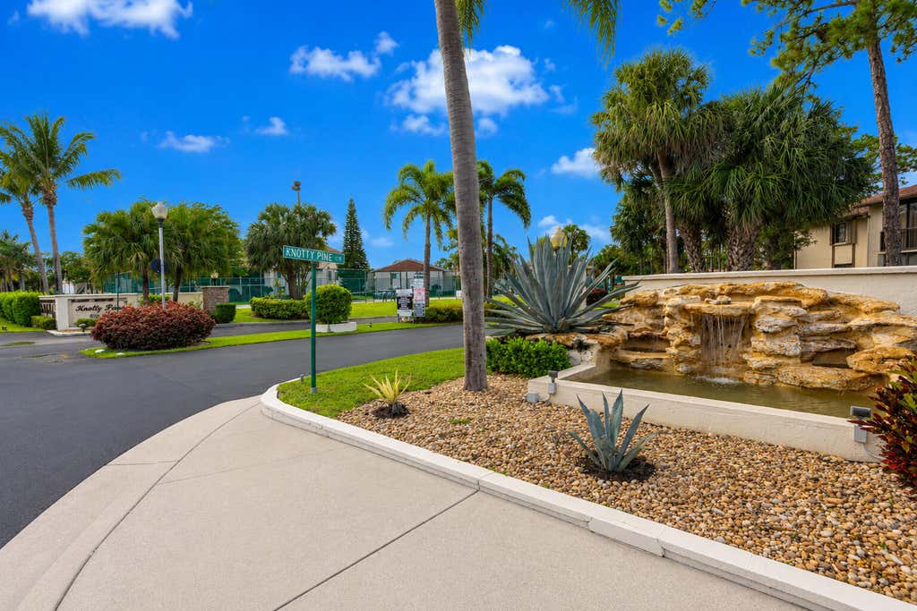 Photo of 303 Knotty Pine Circle #A-1, Greenacres, FL 33463 (MLS # B26036778)