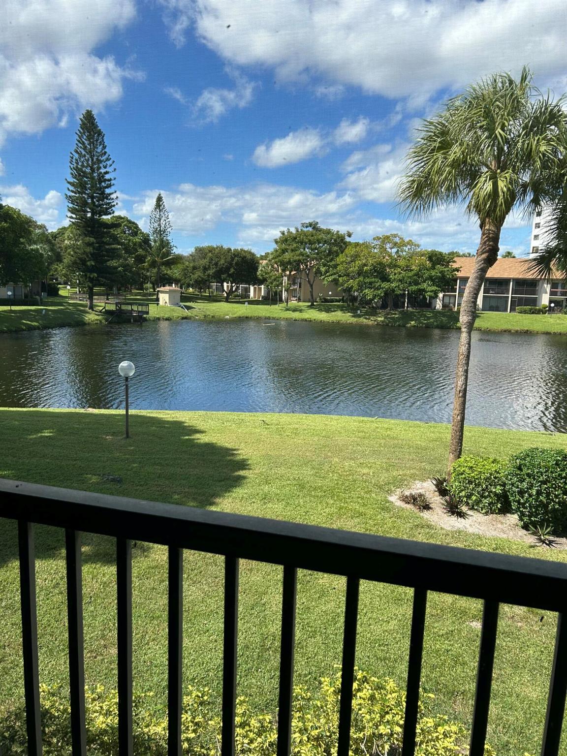 Spotless, updated, well maintained 2-bedroom, 2-bathroom with den condo located in the desirable Meadowridge.  Lots of closets.  Extra storeage in patio. Hurricane shutters.  Gorgeous view of the lake.  Lots of guest parking.  Clubhouse, tennis, pool.  gym. Basic cable and Water.  Easy access to major highways (Sawgrass Expressway, Turnpike and I-95).