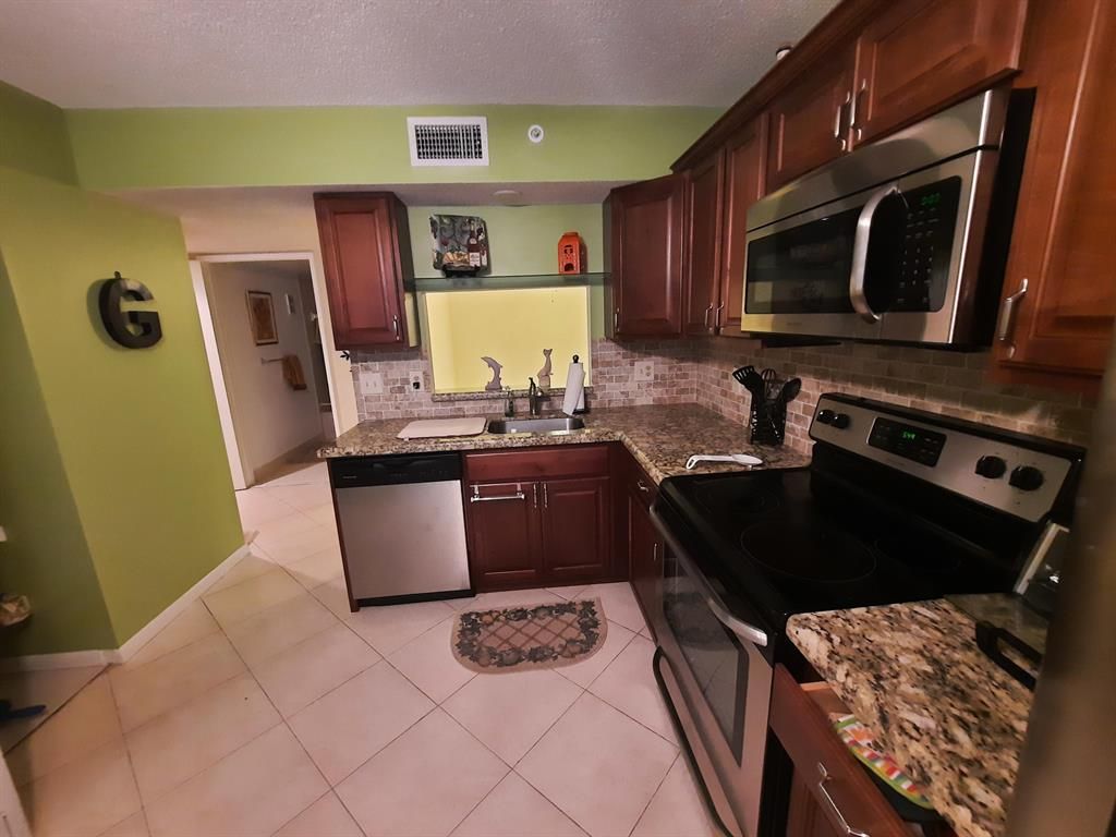Photo of 15364 Lakes Of Delray Boulevard #53, Delray Beach, FL 33484 (MLS # R10716792)
