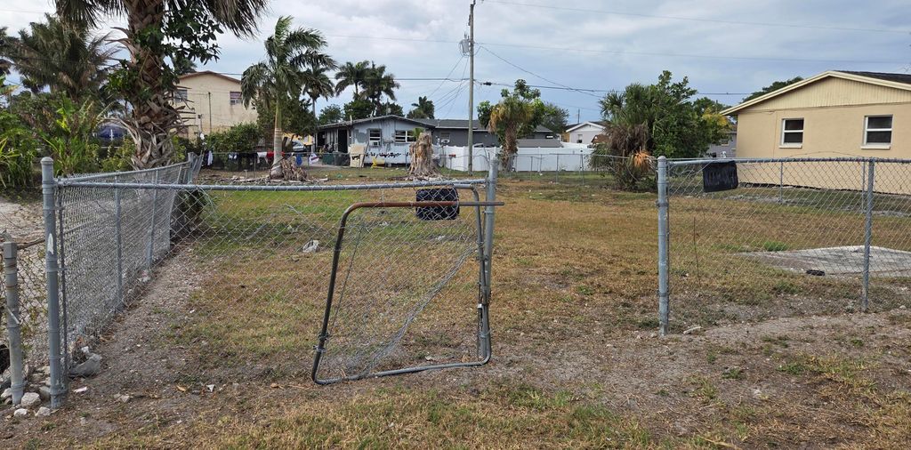 Photo of 640 SW 6th Street, Belle Glade, FL 33430 (MLS # B26023191)