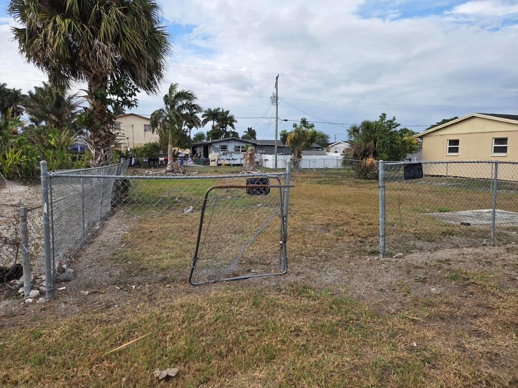 Photo of 640 SW 6th Street, Belle Glade, FL 33430 (MLS # B26023191)