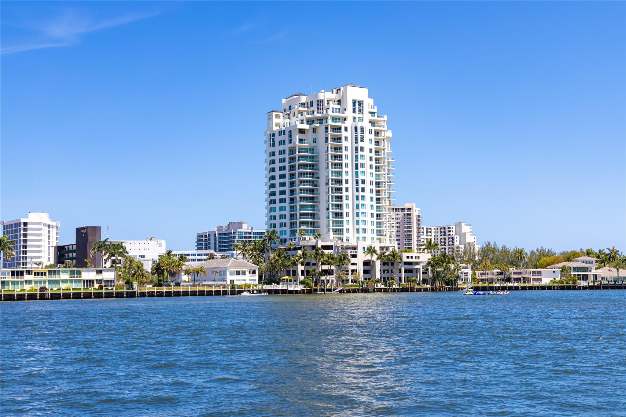 Indulge in the ultimate lifestyle at Harborage Place Condominium, available as an annual rental at $12,500/month. This showpiece 3-bedroom, 2.5-bath residence radiates sophistication with custom designer finishes, gourmet chef’s kitchen with granite counters & breakfast room, & a dedicated media room with state-of-the-art surround sound. Thoughtful details include Control4 smart home automation, dramatic custom silk draperies, & expansive living spaces seamlessly opening to walls of glass w/panoramic views of the Atlantic Ocean, Intracoastal Waterway, & Fort Lauderdale skyline.
Residents enjoy resort-style amenities with heated pool & sundeck, private fitness center, waterfront clubroom. The building offers secure elevator access, 24-hour security, & white-glove concierge assistance.