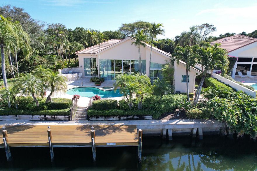 Rare, rare, rare Frenchman's Creek home for luxury resort living, including golf, beach, and boating.  No other development can top the extraordinary, lifestyle amenities offered at Frenchman's Creek Beach and Country Club!! 80' private boat dock with access to the Intracoastal and Sailfish Alley. Unique, extra wide lot so boat will not block your view even on a boat lift. Private, waterfront pool and spa. Two championship golf courses and private golf car garage. Brand new $95 million Clubhouse opening November 2025 offering industry leading hospitality in state-of-the-art facilities.....(see MORE.....)