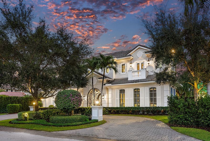 Step into timeless elegance at 1850 Sabal Palm Drive, a remarkable residence on a prime corner lot within the highly sought-after Royal Palm Yacht & Country Club enclave. Crafted to meticulous standards by Janik Corporation, this exceptional property welcomes you with a grand two-story foyer that beckons towards a stunning formal living room with collapsing sliding glass doors to the backyard haven. Delight in the serenity of the outdoors, surrounded by lush landscaping, large turf yard, summer room with kitchen and retractable screen enclosure, and an enticing pool featuring a sun shelf and raised spa!

This sophisticated abode boasts five generously sized bedrooms (including a VIP suite), spacious office, handsome club room, and formal dining room, offering versatility for any hosting needs. The interior showcases exquisite coffered ceilings, traditional millwork accents, and marble and Brazilian cherry wood flooring, casting an ambiance of opulence and warmth. 

Upstairs, go through the loft living room with a bar to the spacious master suite. The owners enjoy a true sanctuary with a spa-like marble-adorned bathroom, boutique closets, and a private balcony overlooking the beautiful backyard. This space is a retreat within the home. 

The residence features a 3-car garage with golf cart storage, ample guest parking in the circular driveway, and a natural gas generator, ensuring efficiency and peace of mind. Welcome to a residence where luxury meets functionality, creating a haven that exceeds expectations.