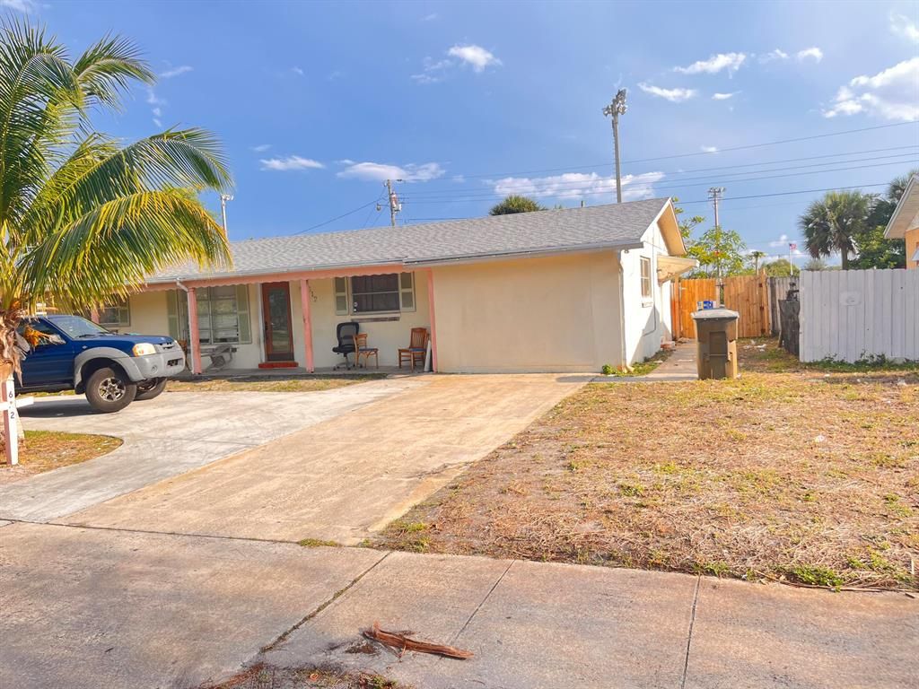 Photo of 612 Date Palm Drive, Lake Park, FL 33403 (MLS # R10882185)