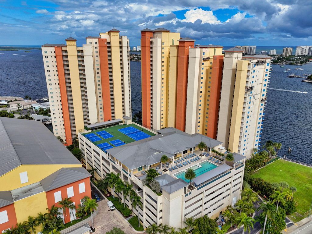 Photo of 2650 Lake Shore Dr #2303, Riviera Beach, FL 33404 (MLS # B26011509)