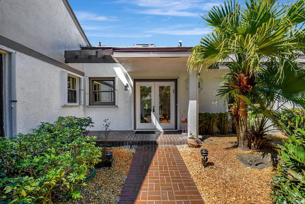 Photo of 35 Clubhouse Lane, Boynton Beach, FL 33436 (MLS # R10962226)