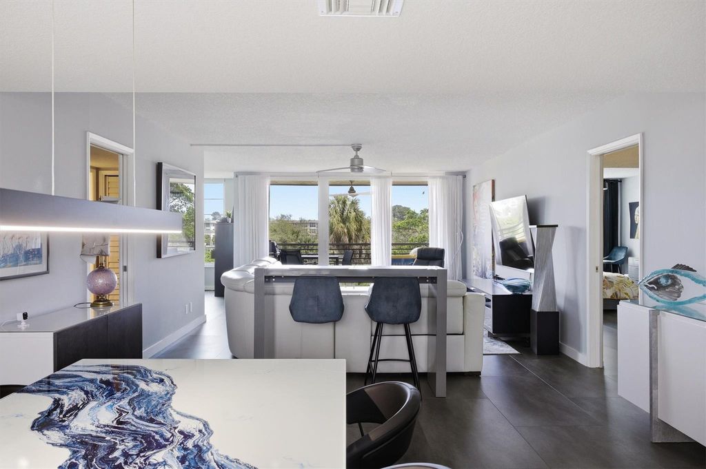 Photo of 3850 Oaks Clubhouse Drive #408, Pompano Beach, FL 33069 (MLS # F10556528)