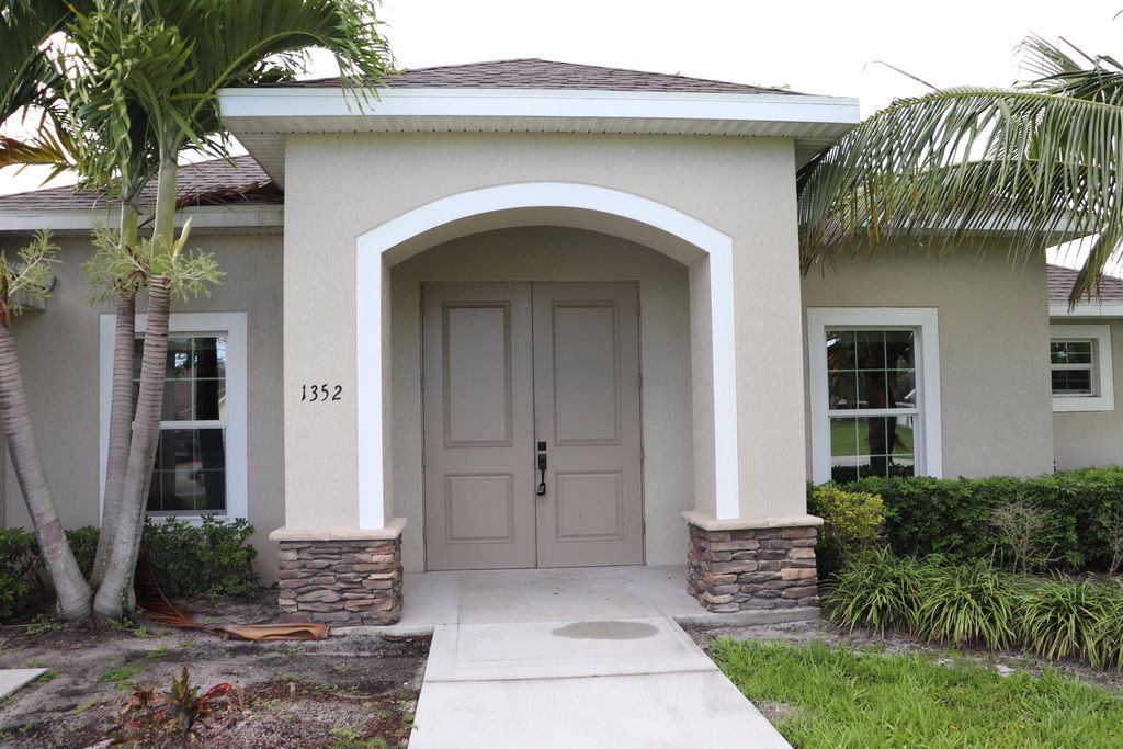 Photo of 1352 SW Fletcher Lane, Port Saint Lucie, FL 34953 (MLS # R10961088)