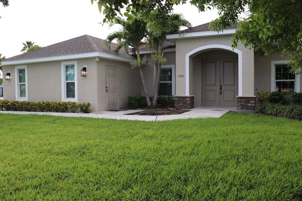 Photo of 1352 SW Fletcher Lane, Port Saint Lucie, FL 34953 (MLS # R10961088)