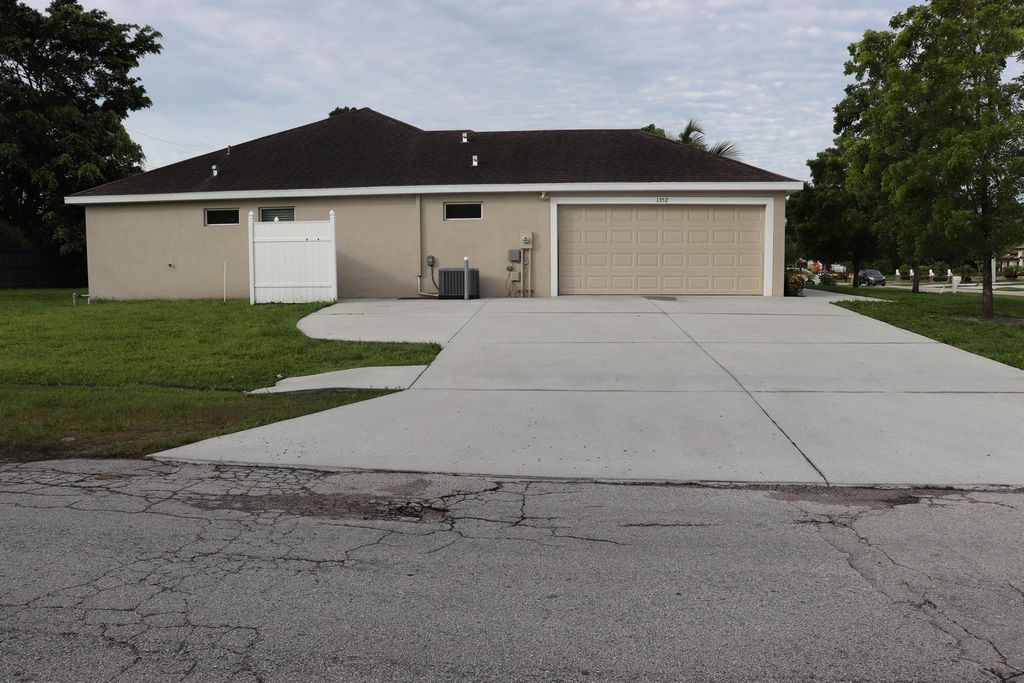 Photo of 1352 SW Fletcher Lane, Port Saint Lucie, FL 34953 (MLS # R10961088)