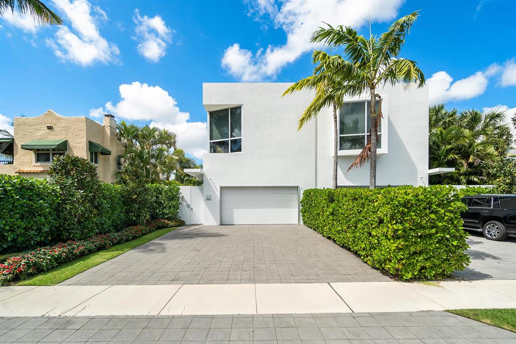 Semi-urban luxury ultra modern oasis on a quiet residential street walking distance to downtown Delray shops, restaurants and beach. Award winning decorator and architect. Indoor/outdoor living with lush privacy landscaping, pool with fountain, retractable screen lanai with fire pit, collapsable sliding impact glass doors. Oversize garage with a/c and full closets and 6 parking spots on driveway. Full house generator. Queen size Murphy bed in front bedroom/exercise room, Steam shower in Master bath, Toto washlet toilet, new quartz countertops, oversize wolf oven and range, housekeeper maintained, impeccable like-new home.