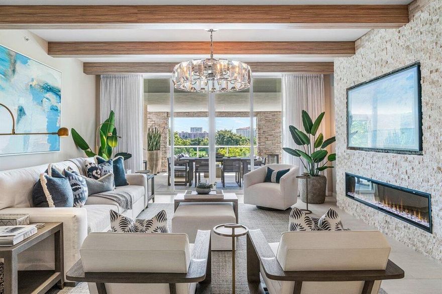 A one-of-a-kind EAST facing residence at Boca Raton's most sought after address. Residence 405 is simply unmatched! The condos' carefully calculated customizations completely enhance its living experience. From the moment you enter this 2-bedroom plus den you will be immersed in style and sophistication. Immediately your eyes are drawn to the oversized loggia overlooking The Boca Raton Resort and then the detailed design elements of wood block beams, custom wall with fireplace & statement light fixtures will capture your attention. The home boasts a never before seen, custom-made, built-in wine tasting room and coffee bar. The open den transcends into a private room with a push of a  button that creates a frosted privacy glass. ALINA's luxury amenity program rivals any 5-star resort.