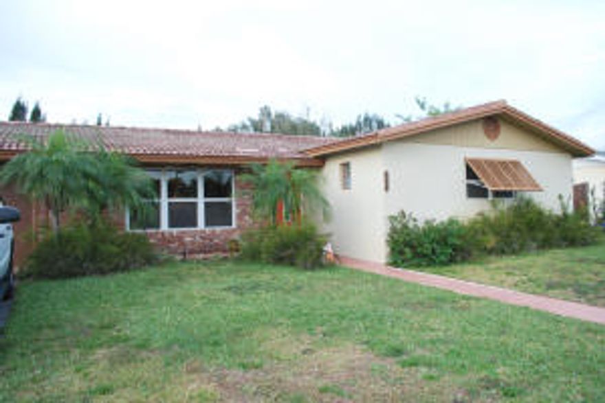 Gorgeous one story home in a private setting with canal and green space at the rear. NO HOA! Kitchen renovated with new cabinets, appliances and granite counters. Large living space with Family/Florida Room as well as living room and dining area. The garage was converted to add a Flex Room but can be converted back. Huge backyard with large pool and screened/covered patio. There's nothing to do except move right in!