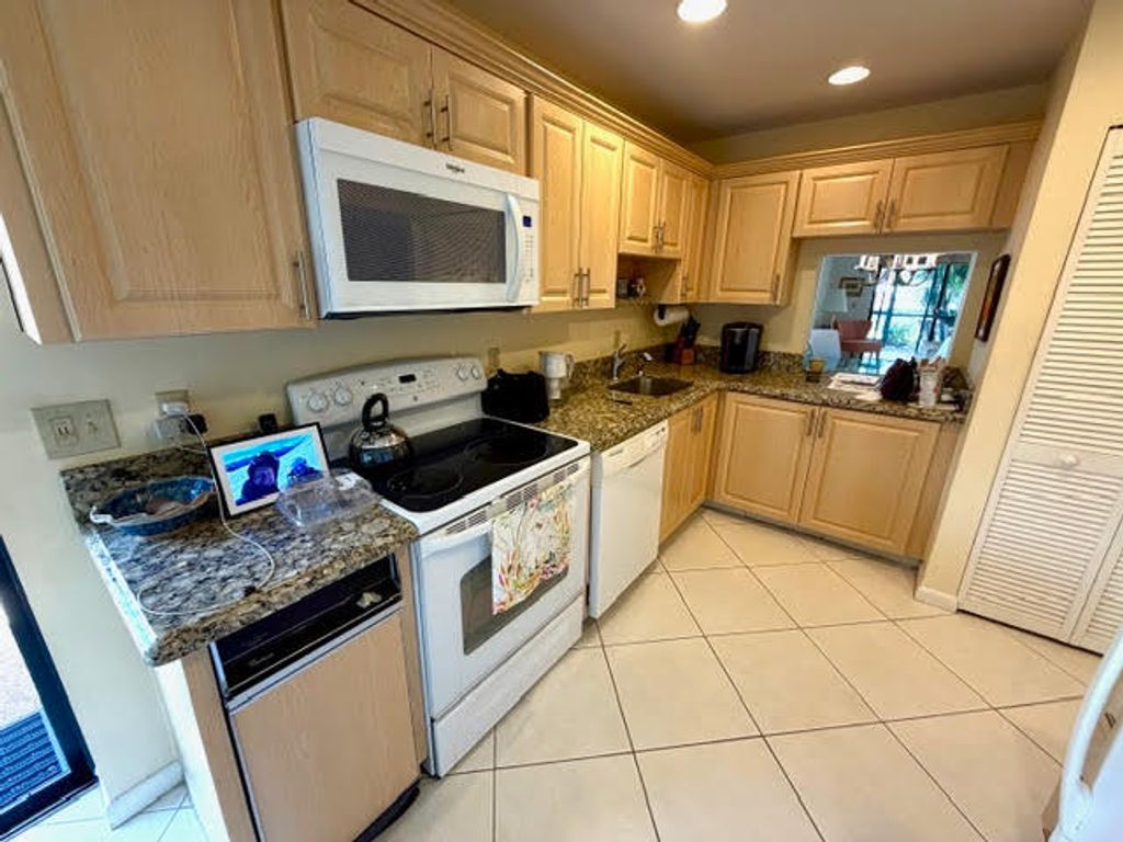 Photo of 10 Southport Lane #A, Boynton Beach, FL 33436 (MLS # B26012307)