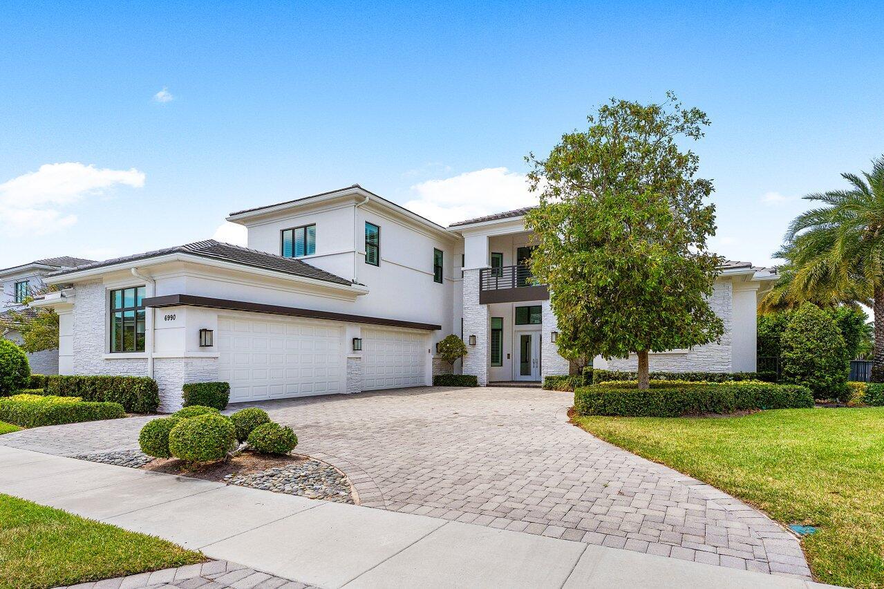 Welcome to an extraordinary offering in Royal Palm Polo, one of Boca Raton's premier luxury community. This exquisite Dalenna model showcases 6 bedrooms, 5.1 bathrooms, an office, loft, and a 4-car garage, and is thoughtfully positioned on a private corner lot. Designed for both grand entertaining and everyday living, the home features a resort-style backyard with a sparkling pool, built-in spa, and fully appointed summer kitchen. Inside, the home is masterfully upgraded with a chef's kitchen boasting Wolf and Sub-Zero appliances and an oversized island perfect for gatherings. Royal Palm Polo residents enjoy exclusive amenities, gated security, and an unmatched location just moments from Boca Raton's finest shopping, dining, and beaches.