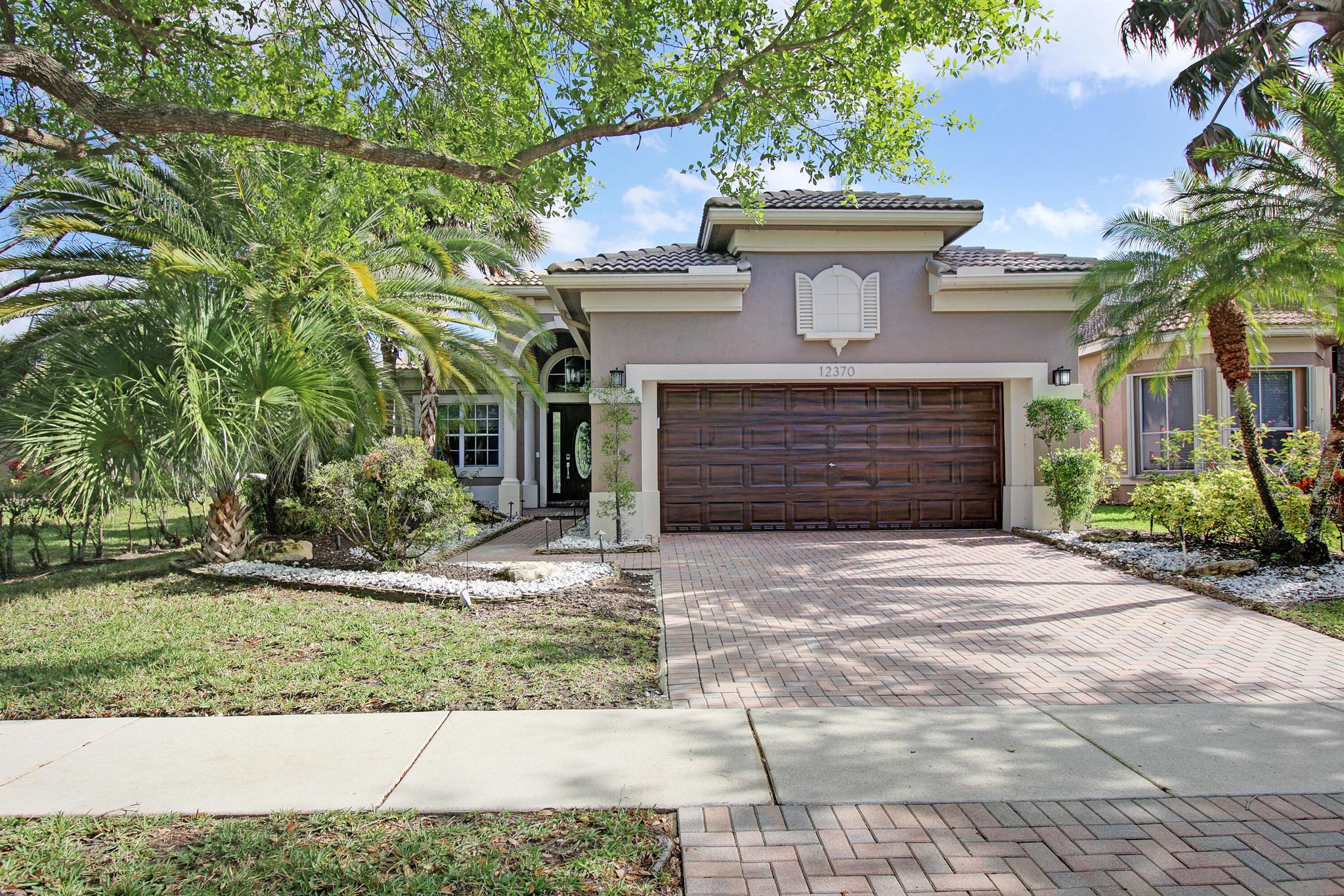 Gorgeous 3-bedroom home in Heron Bay! Features a spacious layout with high ceilings, modern kitchen with quartz counters, stainless steel appliances, and beverage refrigerator. Tile, and laminate floors throughout. Enjoy lake views from the large backyard. Located in an A+ school district with access to resort-style amenities at the Heron Bay clubhouse.