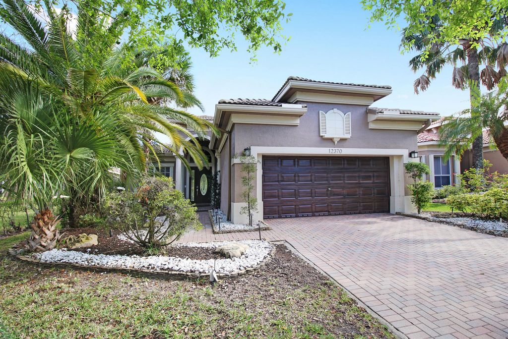 Photo of 12370 NW 78th Manor, Parkland, FL 33076 (MLS # R11089036)