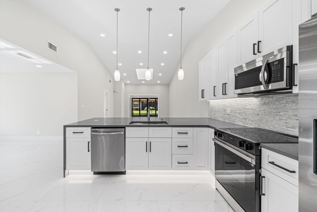 Photo of 6371 Kings Gate Circle, Delray Beach, FL 33484 (MLS # B26026592)