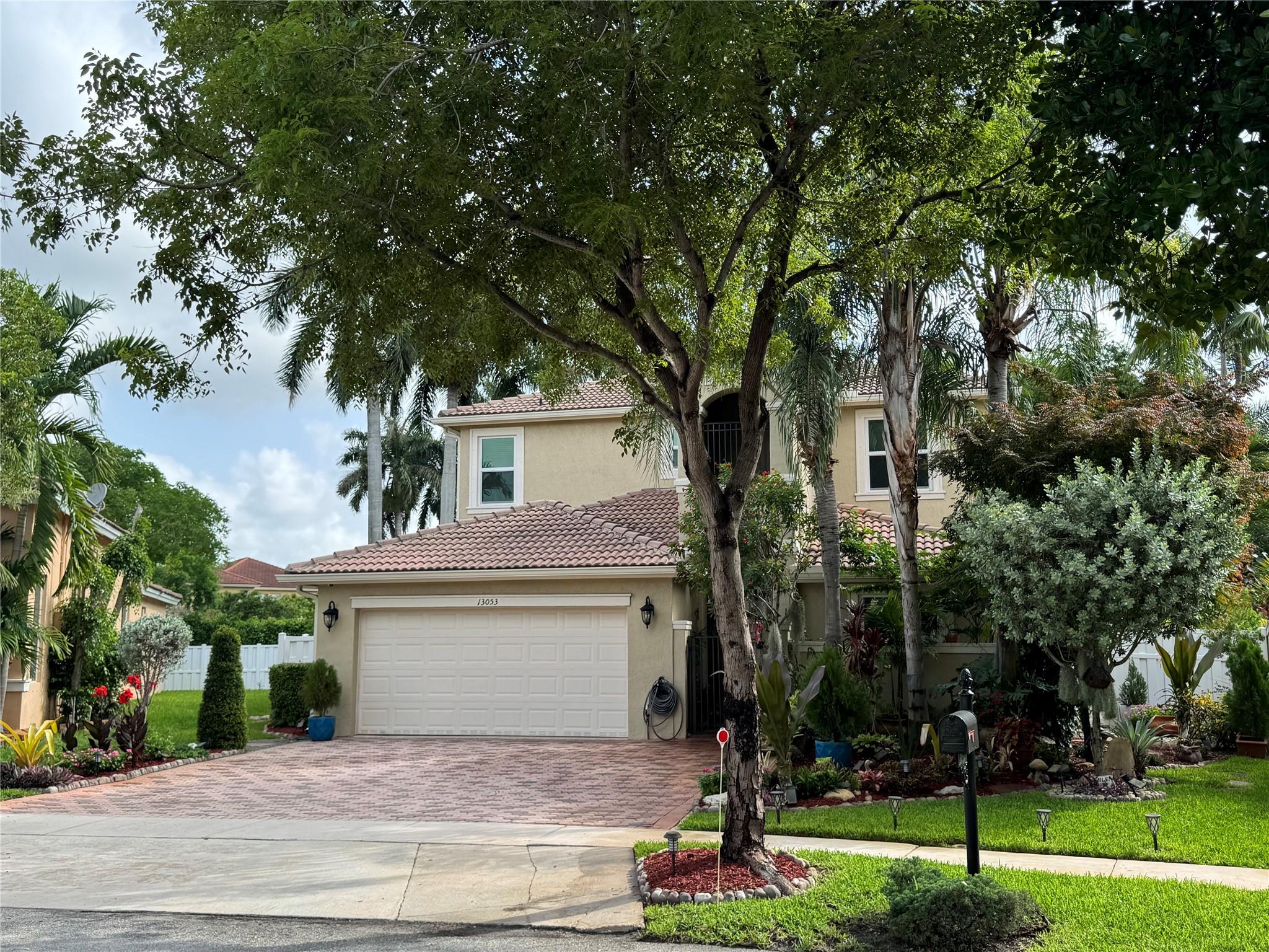 This Inviting 4 bed/3 bath two story home located in desirable gated Biltmore Estates in Monarch Lakes. This fantastic open floor plan offers the convenience of a downstairs suite with a full bathroom, large lot with room for a pool. Gathering style kitchen for any chef’s delight with lots of storage and counter space, family room flowing seamlessly into the outdoor fenced backyard and covered patio with mature palms & fruit trees. Expansive primary ensuite with a sitting area, balcony and a builder’s option of a fifth bedroom not included in the bedroom count plus a loft and nicely sized bedrooms, 2022 Hurricane impact glass, two AC units, Large laundry room, Low HOA offers a pool, play ground, tennis & Basketball. One or more pictures has been virtually staged.