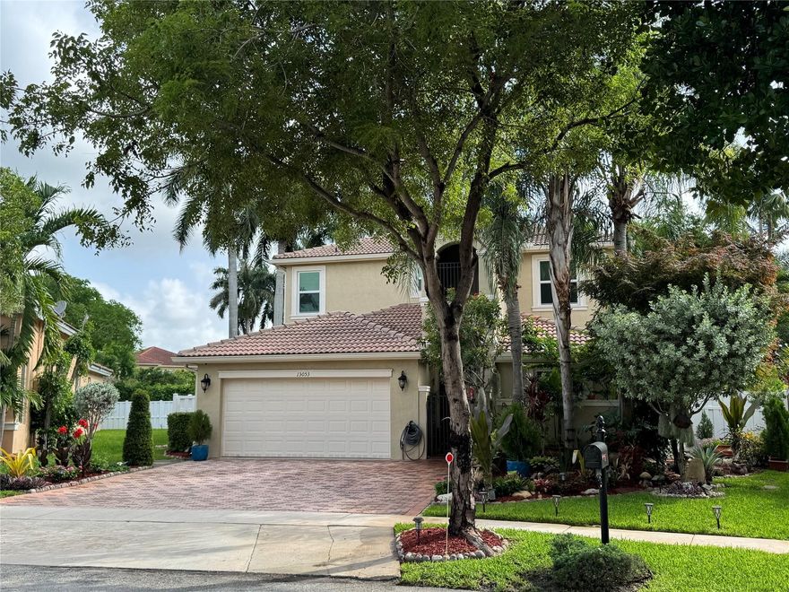 This Inviting 4 bed/3 bath two story home located in desirable gated Biltmore Estates in Monarch Lakes. This fantastic open floor plan offers the convenience of a downstairs suite with a full bathroom, large lot with room for a pool. Gathering style kitchen for any chef’s delight with lots of storage and counter space, family room flowing seamlessly into the outdoor fenced backyard and covered patio with mature palms & fruit trees. Expansive primary ensuite with a sitting area, balcony and a builder’s option of a fifth bedroom not included in the bedroom count plus a loft and nicely sized bedrooms, 2022 Hurricane impact glass, two AC units, Large laundry room, Low HOA offers a pool, play ground, tennis & Basketball. One or more pictures has been virtually staged.