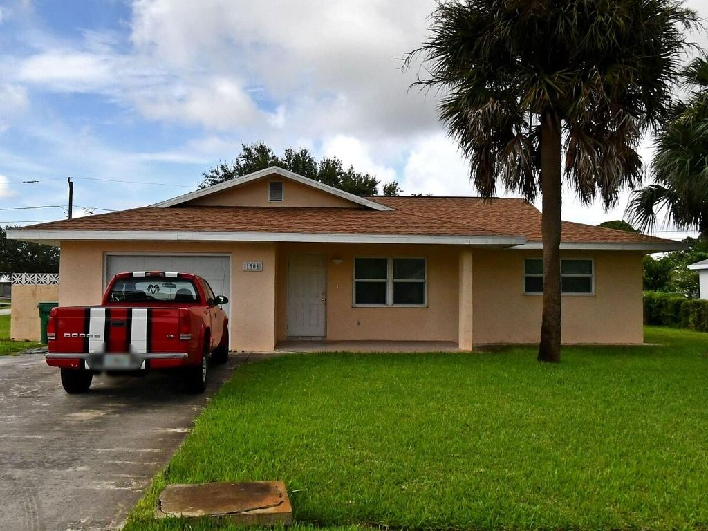 Photo of 1501 SE Minorca Avenue, Port Saint Lucie, FL 34952 (MLS # B26005888)