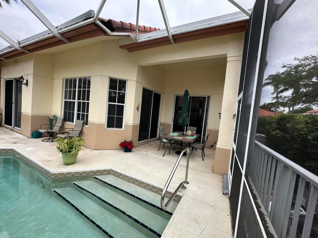 Photo of 77 Spyglass Way N, Palm Beach Gardens, FL 33418 (MLS # B26015997)