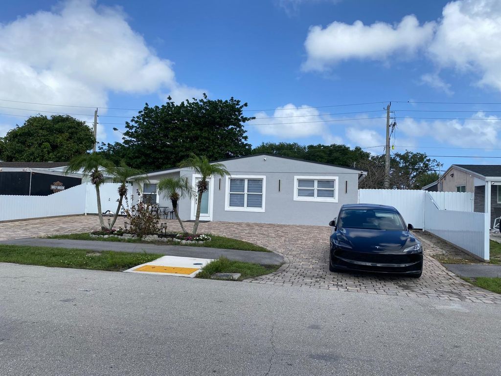 Photo of 112 E Browning Drive, West Palm Beach, FL 33406 (MLS # B26012103)