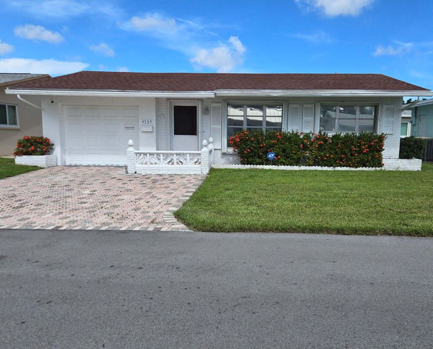 If you are looking for a quite 55+ community,this 2 Bedroom, 2 Bath home is the perfect pick! it is located in the highly valued Mainlands of Tamarac! Easy access to Publix, Shops and Banks located in Sunshine Plaza on Commercial and five minutes away the Florida Turnpike. Property offers manicured lawn with sprinkler Systems and paver double size driveway leading into the enclosed garage with storage cabinets for those extra items. Washer and Dryer, updated in 2022, are conveniently located in the garage outside of the kitchen with a laundry tub replaced in 2023. Kitchen has stainless steel appliances updated in 2022! New AC and hot water heater in 2023! Accordion shutters on all windows! Home is tiled throughout except living room where carpet sts it apart, giving off a feeling, g