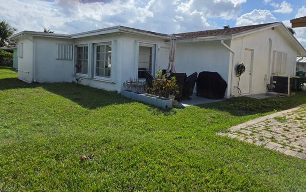 Photo of 4504 NW 43rd Terrace, Tamarac, FL 33319 (MLS # B26005117)