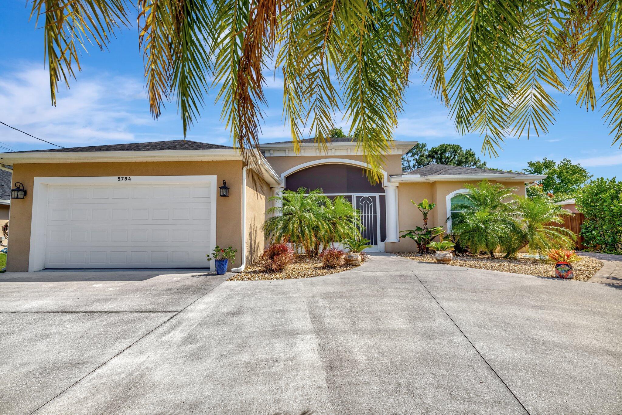 Absolutely Gorgeous Custom Built 4 Bedroom, 3 Bathroom Pool Home Located on a Quiet Street in the Desirable Torino Area with No HOA. Designer Architectural Ceilings with Crown Molding, Wainscoting, 8' Doors, Plank Tile Flooring Throughout and Formal Living & Dining Rooms. The Kitchen Features Center Island with Wet Bar, 42'' Cabinets, Granite Countertops And Stainless Appliances. The Owners Suite has a Double Door Entry with Dual Vanities & Walk-In Closets and French Door Leading to the Fenced Yard Overlooking Screened Heated Pool with Extensive Paver Patio Area. The Exterior Also Features Screened Porch, Upgraded Landscaping and Circular Driveway. Conveniently Located Within Minutes to I-95, Saint Lucie West and Shopping! This Home Shows Like a Model Home and Will Not Disappoint!!