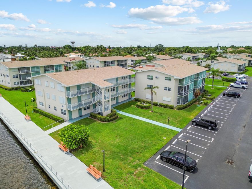 Beautifully maintained 1bdrm, 1bth condo in E. Boynton Beach, first floor for easy access & everyday convenience. Bright, open layout filled with natural light & features a remodeled kitchen with solid wood cabinetry, granite countertops, stainless steel refrigerator, & breakfast bar overlooking the living & dining areas. Bedroom offers peaceful water views & ample closet space, while the lanai is the perfect place to relax & enjoy coastal breezes & passing boats. Features include luxury vinyl plank flooring throughout, fresh paint, accordion hurricane shutters. Just minutes from Boynton Harbor Marina. Walk or bike to the beach. Enjoy the amenities of a heated pool, clubhouse, fitness center, billiards, pickle ball, bocce, shuffleboard & putting green. Make this coastal retreat yours today