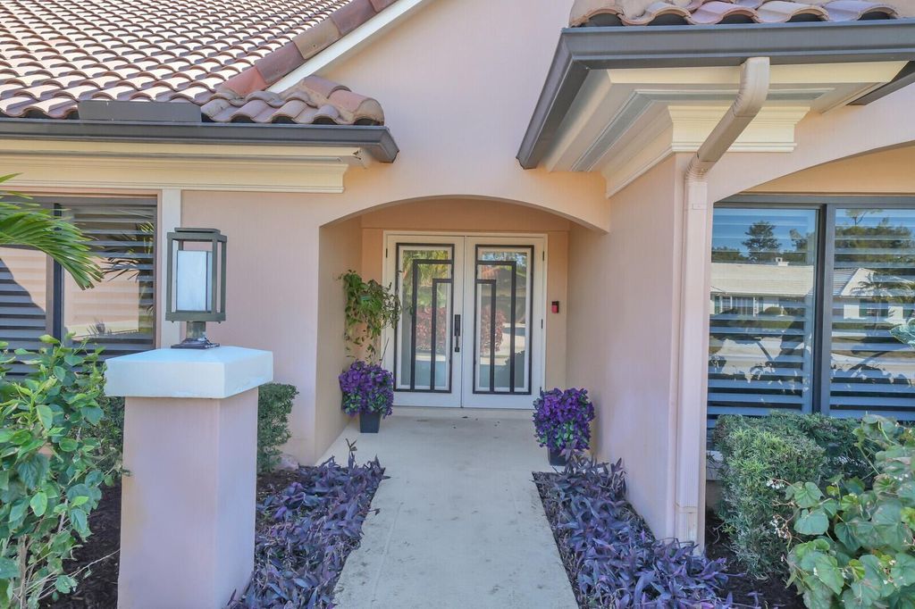 Photo of 513 N Country Club Drive, Atlantis, FL 33462 (MLS # R11163008)