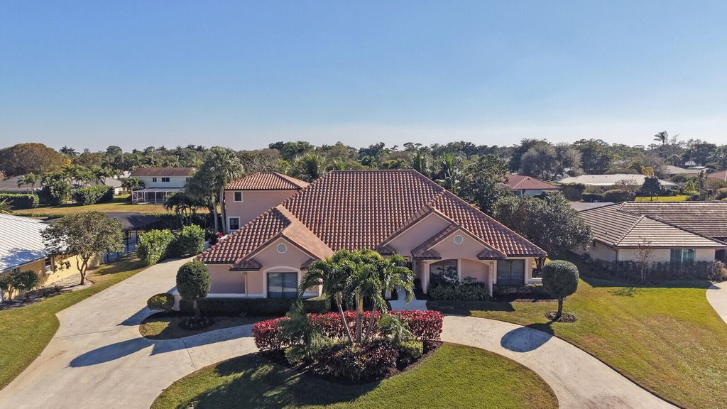 Photo of 513 N Country Club Drive, Atlantis, FL 33462 (MLS # R11163008)