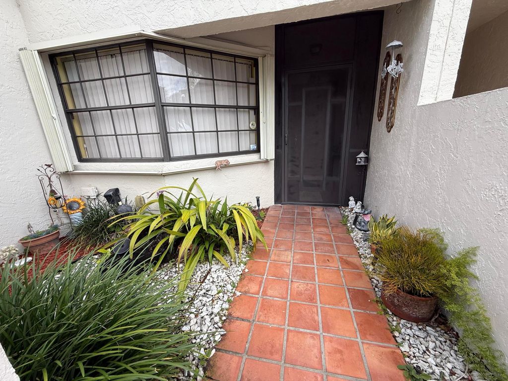 Photo of 5878 Parkwalk Circle W, Boynton Beach, FL 33472 (MLS # B26030623)