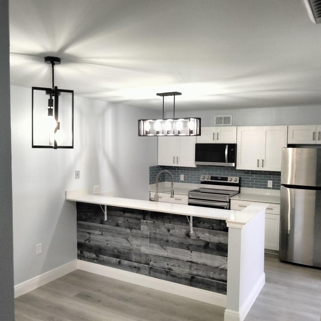 Photo of 234 Charter Way, West Palm Beach, FL 33407 (MLS # B26080339)