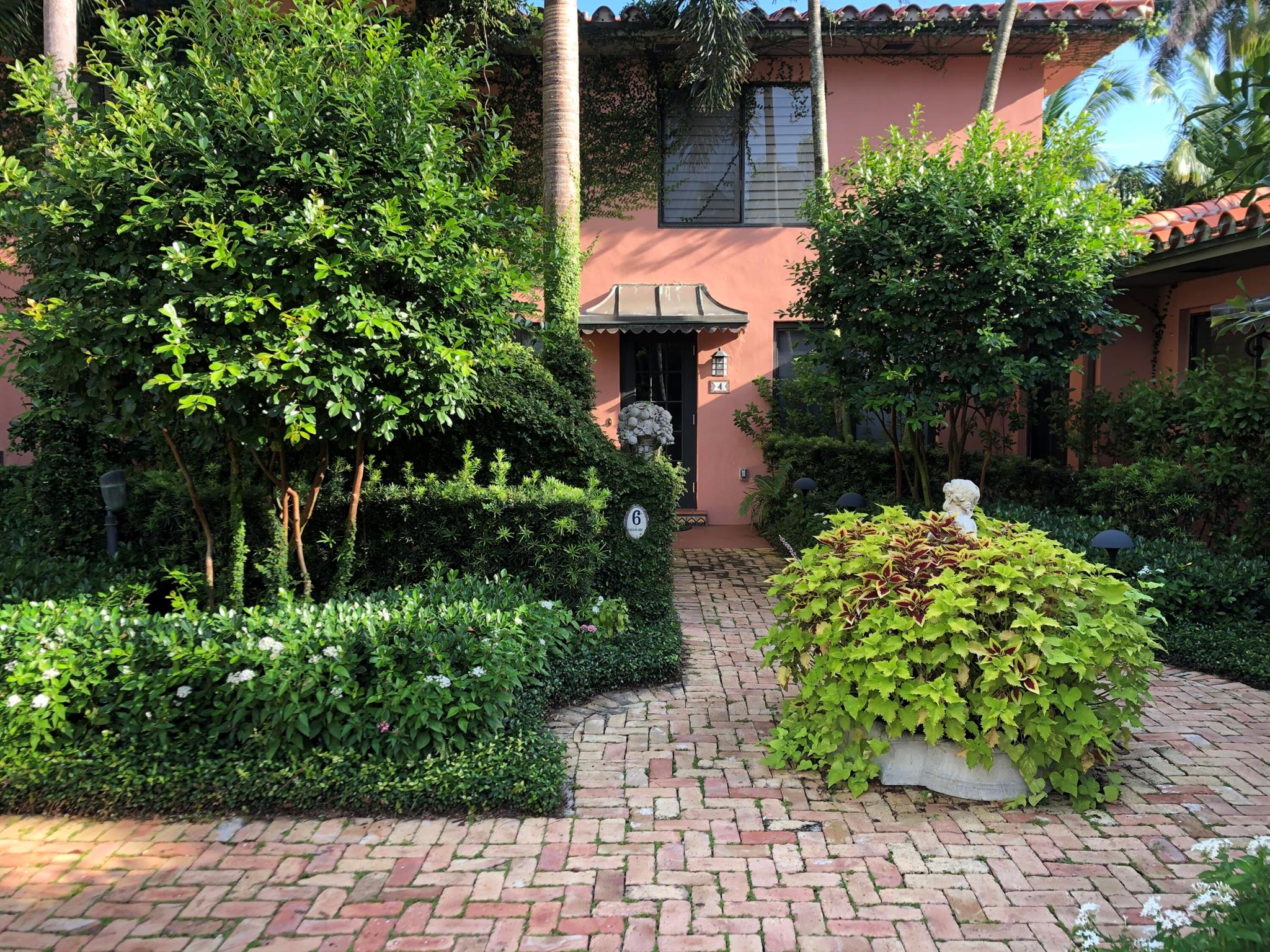 Gorgeous Pied-a-Terre with Tropical Garden in Prime Palm Beach Location. A charming and beautifully maintained 2 BR, 2 BA nestled in the heart of Palm Beach. This cozy yet elegant residence offers the perfect blend of indoor-outdoor living, featuring multiple patios ideal for al fresco dining, entertaining, or simply relaxing under the palms.Located just steps from Worth Avenue, world-class restaurants, boutique shopping, and the beach, this hidden gem is truly walkable luxury. Inside, enjoy a bright, welcoming layout with stylish finishes and serene bedroom suites.Situated in an intimate building with just a few residences, this home is available for annual rental or seasonal stays (6-month minimum). A rare opportunity to enjoy the very best of in-town Palm Beach living.