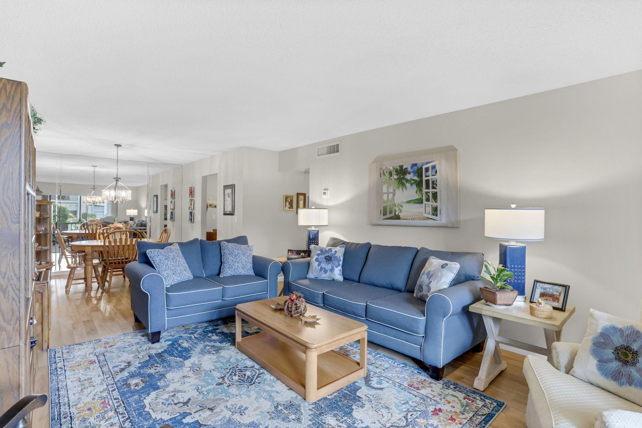 Nestled in the tranquil, tree-filled neighborhood of Bent Tree Gardens, discover the perfect blend of comfort and style in this beautifully maintained 2 bedroom, 2 bath condo. As you step inside this first-floor unit, you're welcomed by an open concept living and dining area bathed in natural light, complemented by wood flooring that adds warmth and elegance. The kitchen features an updated backsplash and warm cabinetry with room for a bistro table and chairs to enjoy your morning paper. The spacious master bedroom offers a serene retreat and features elegant plantation shutters that invite natural light while ensuring privacy.