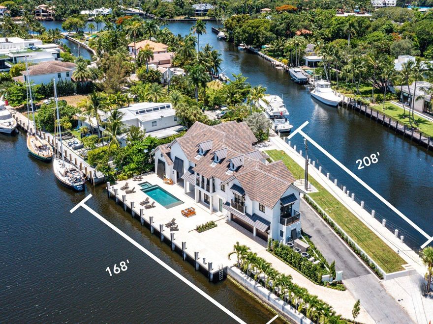 Discover waterfront luxury in Las Olas Isles, Fort Lauderdale. This architectural masterpiece, designed by Art Bengochea, boasts 6 beds, 6.5 baths, and spans 6,759 sq ft. Enjoy 376 ft of waterfront with two docks catering to boating enthusiasts. The chic great room offers soaring ceilings and expansive glass windows, seamlessly blending indoor-outdoor living. The gourmet kitchen features custom cabinetry, marble counters, and high-end appliances. The primary suite opens to tranquil waterfront views, boasting dual walk-in closets and a spa-inspired bathroom. Upstairs, a secondary primary bedroom and two guest suites ensure ample accommodation.