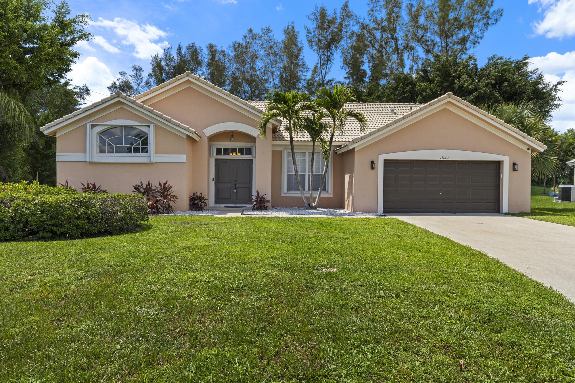 Embrace the Florida lifestyle in this upgraded home on almost 1/2 acre cul-de-sac lot in desirable Binks Hidden Creek. This residence offers an open floor plan & showcases modern sophistication. The kitchen is a culinary delight, featuring granite countertops & newer soft-close cabinets. The spacious primary bedroom includes a comfy sitting area, creating a private retreat. Each bathroom has been thoughtfully remodeled w/newer white cabinets & granite countertops. 12x24 tile flooring flows seamlessly throughout the home.Newer accordion shutters were installed 7/24. Discover a spacious screened patio w/structural concrete columns, ideal for al fresco dining & entertaining by the newly revitalized oversized pool with its azure blue gem finish & new tile. Walking distance to top rated school