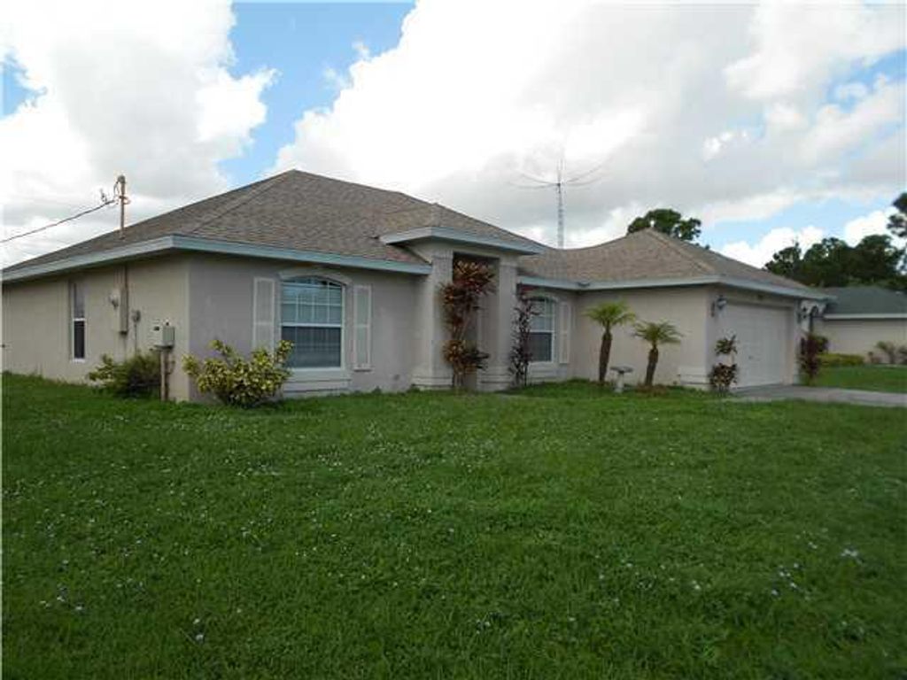 Photo of 2112 SW Burlington Street, Port Saint Lucie, FL 34984 (MLS # R10983530)