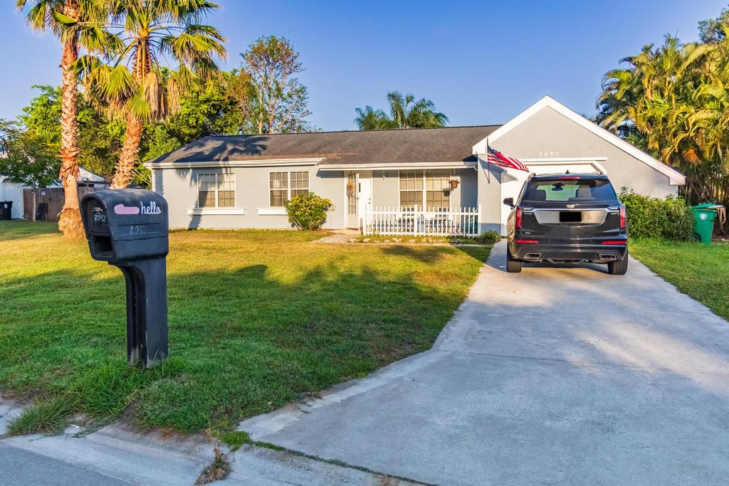 Photo of 2097 SE New York Street, Port Saint Lucie, FL 34952 (MLS # R11084643)